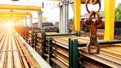 Pier bridge crane and cargo handling cargo trains transported away.