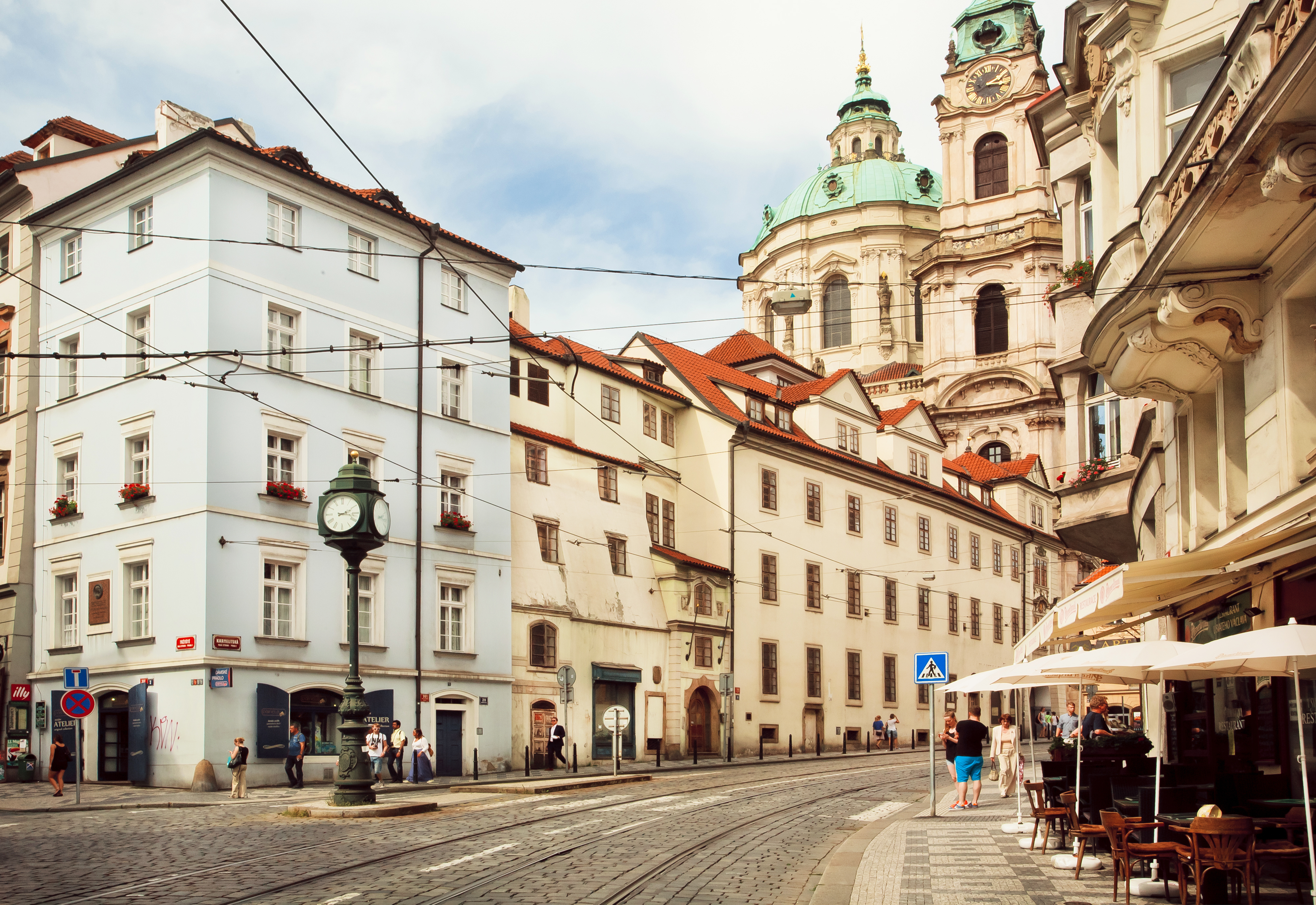 Historical Cityscape Of Praha With Old Houses And Stores