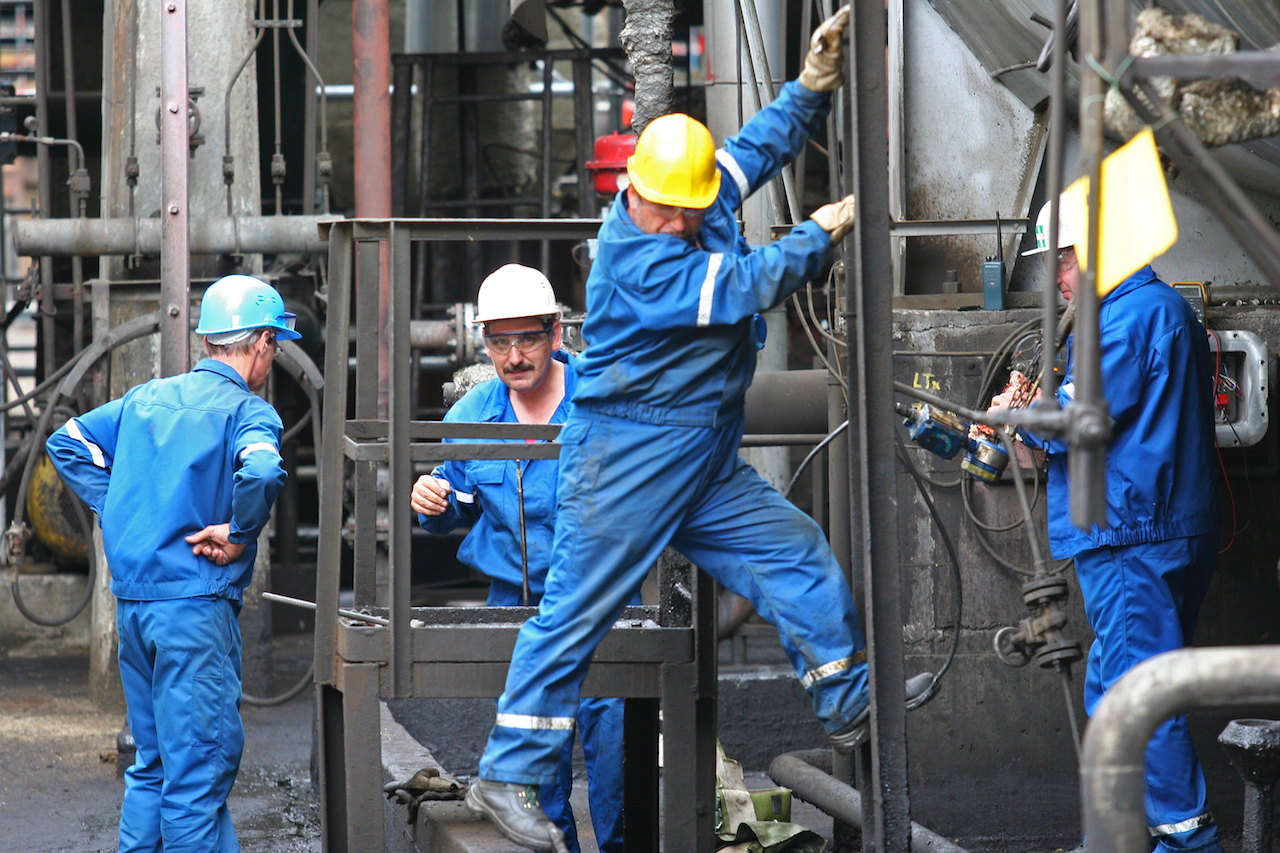 BUCHAREST, ROMANIA – NOV 9: Oil workers perform maintenance duties at the Arpechim refinery near Pit