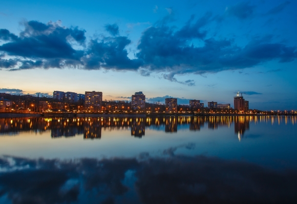 Night city reflection on the river in Donetsk. Ukraine