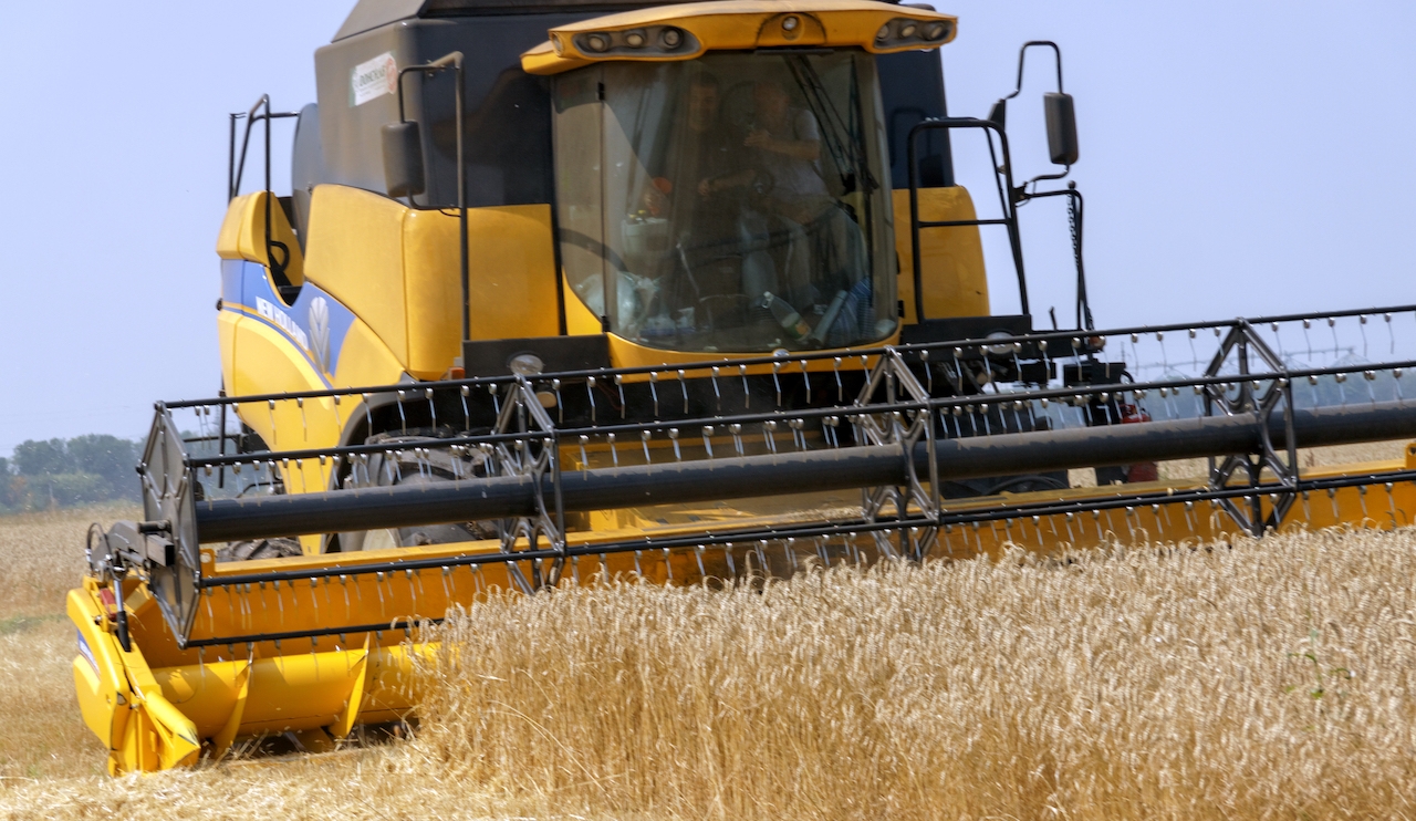 Kharkiv region Ukraine - July 29 2016: Combine harvests wheat on a field in Kharkiv region Ukraine on July 29 2016