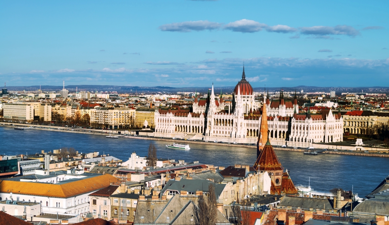 Budapest, Hungary. Aerial view of the old city Budapest, Hungary with river and Parliament Building with cloudy blue sky