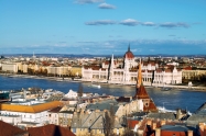 Budapest, Hungary. Aerial view of the old city Budapest, Hungary with river and Parliament Building with cloudy blue sky