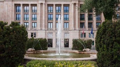 Front of finance ministry in Warsaw Poland with a fountain framing the entrance. Could be used for images about Euro currency problems