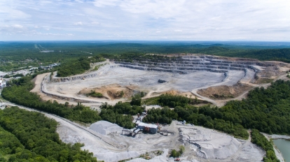Aerial view over the building materials processing factory. View from above.