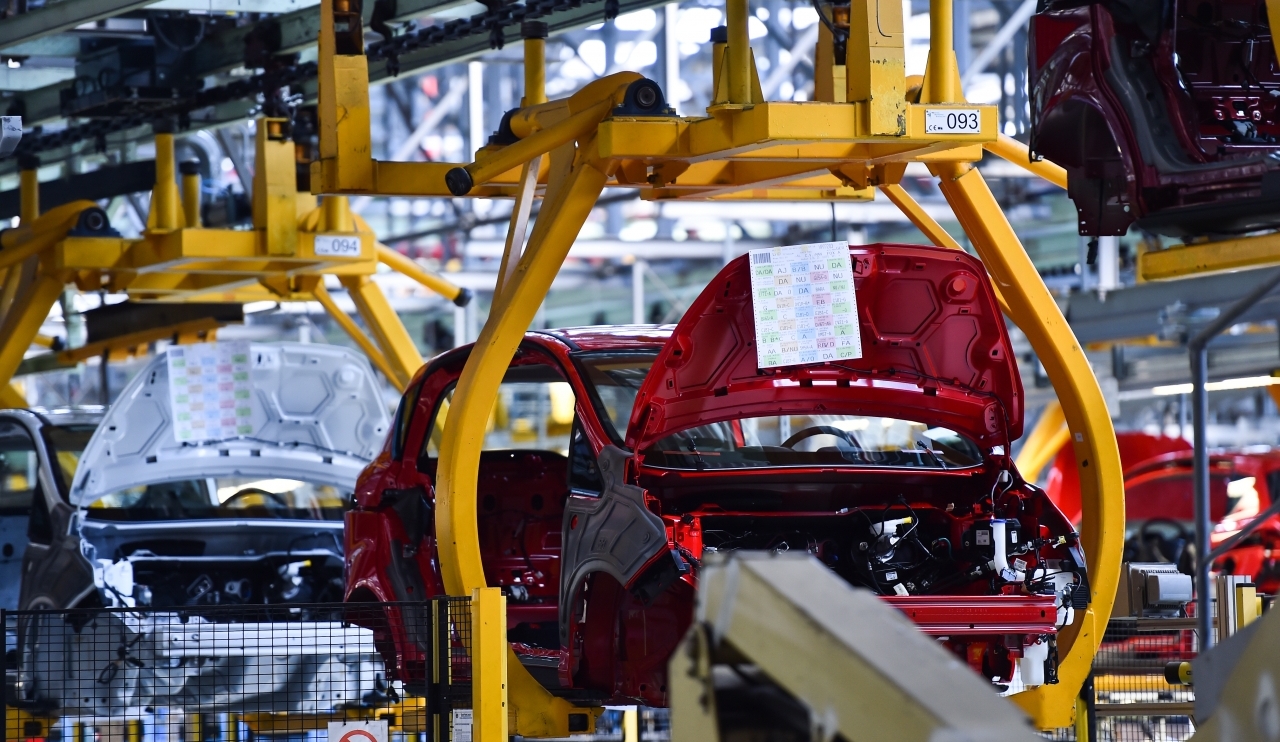 Car bodies on the production line inside automobile factory