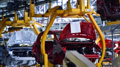 Car bodies on the production line inside automobile factory