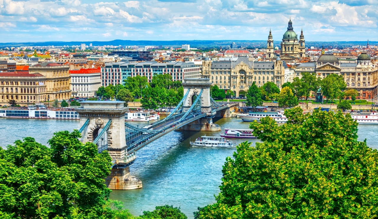 Chain bridge on Danube river in Budapest city. Hungary. Urban landscape panorama with old buildings and domes of opera