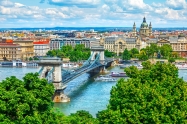 Chain bridge on Danube river in Budapest city. Hungary. Urban landscape panorama with old buildings and domes of opera