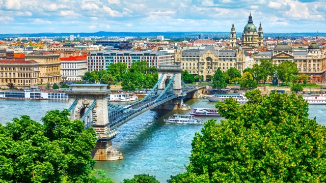 Chain bridge on Danube river in Budapest city. Hungary. Urban landscape panorama with old buildings and domes of opera
