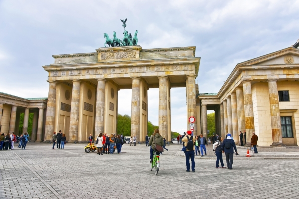 Brandenburg Gate in Berlin in Germany. The Brandenburg Gate is a triumphal arch a city gate in the center of Berlin. It is one of the most known sites in Berlin.