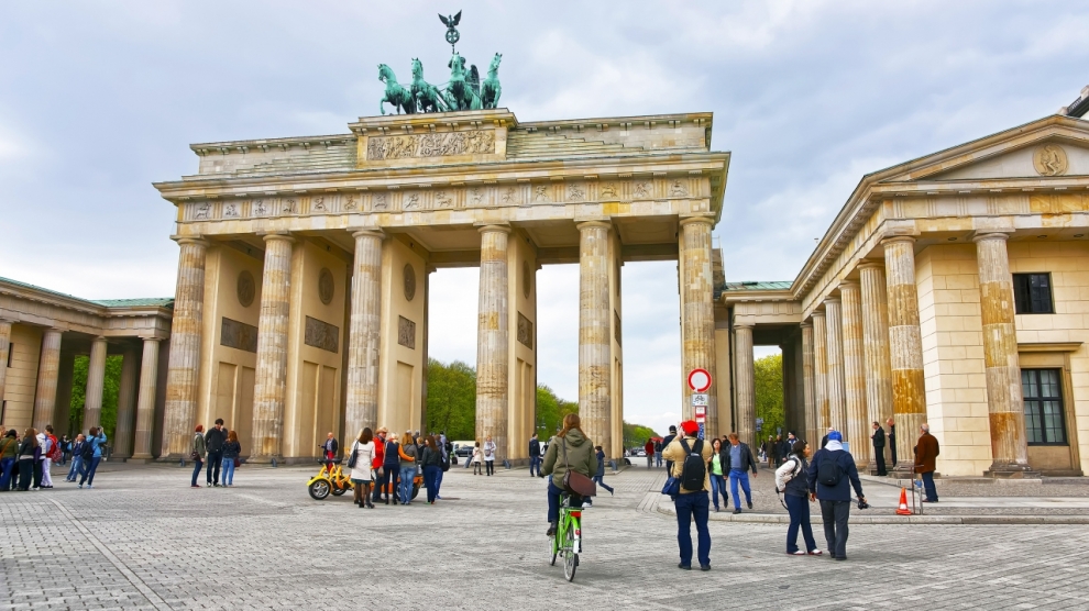Brandenburg Gate in Berlin in Germany. The Brandenburg Gate is a triumphal arch a city gate in the center of Berlin. It is one of the most known sites in Berlin.