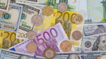 dollar pound euro coin on euro background.