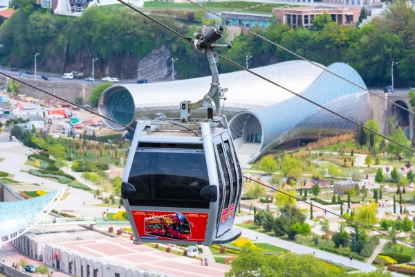 Tbilisi, Georgia - April 29, 2017: Tbilisi red cable car fulicular cabin and aerial city skyline panoramic view
