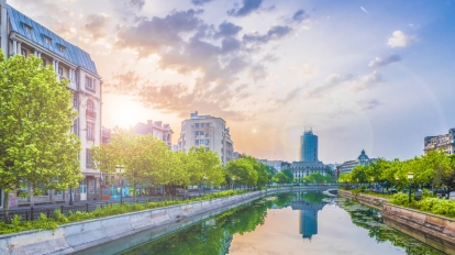 Dambovita river and center of Bucharest at sunset time Romania.