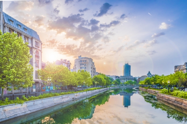 Dambovita river and center of Bucharest at sunset time Romania.
