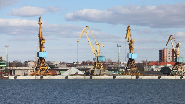 Industrial dock with cranes on the quay