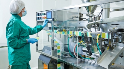 pharmaceutical factory woman worker operating production line at pharmacy industry manufacture factory