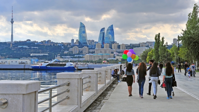 BAKU AZERBAIJAN - SEPTEMBER 25: People goes by the seafront of Baku on September 25 2016. Baku is a capital and largest city of Azerbaijan.