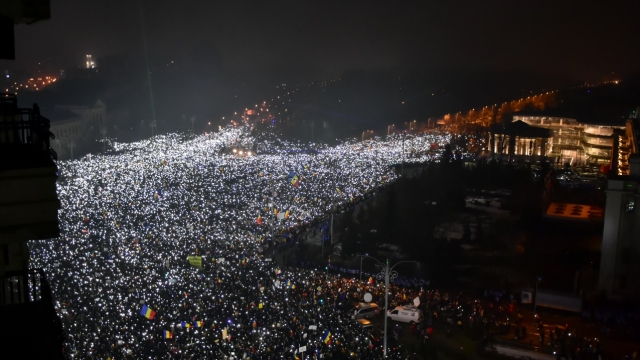 BUCHAREST, ROMANIA - 05 February 2017: More than 240,000 protesters in Victory Square (Piata Victoriei). "Torches" moment. At 09:00PM Romanian protesters shone torches on their phones.