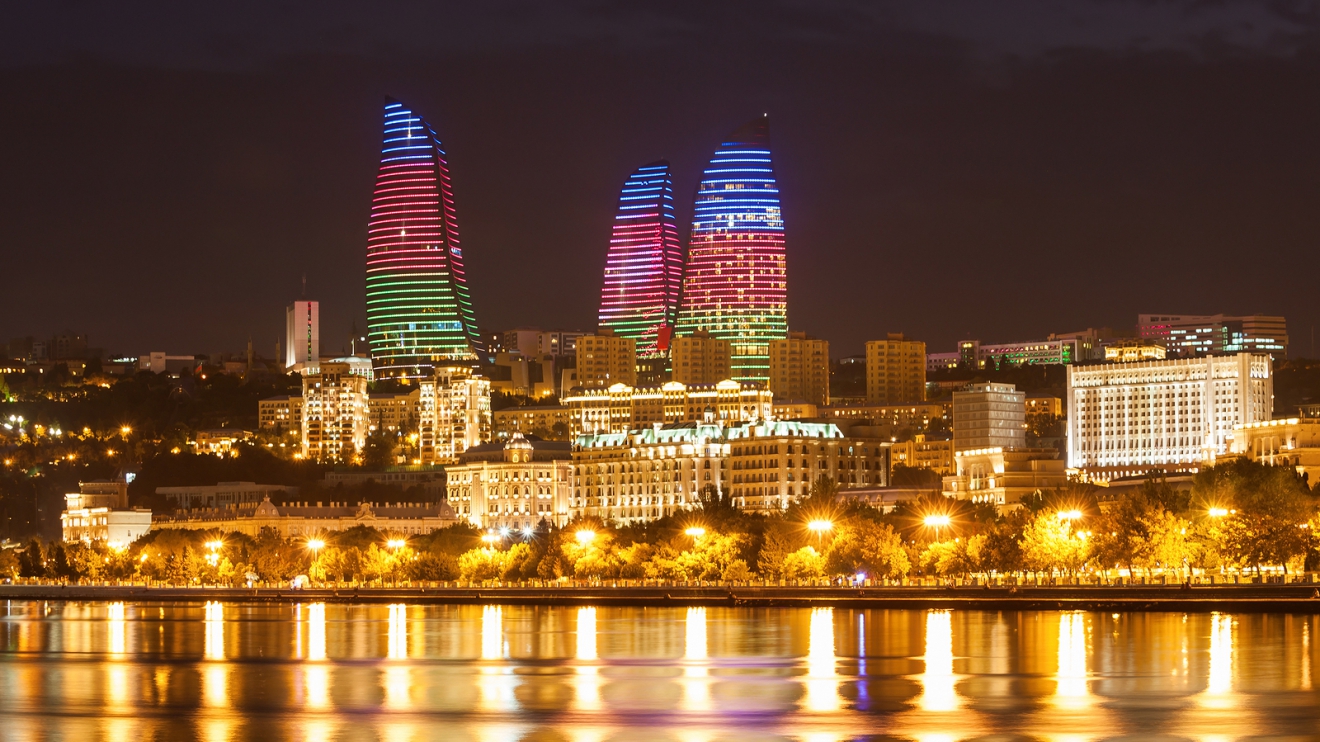 BAKU AZERBAIJAN - SEPTEMBER 15 2016: Baku Flame Towers at night. It is the tallest skyscraper in Baku Azerbaijan with a height of 190 meters.