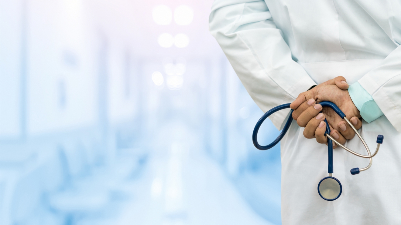 Male Doctor In The Hospital Or Doctor Office. Concept Of Medical Technology And Doctor Career.