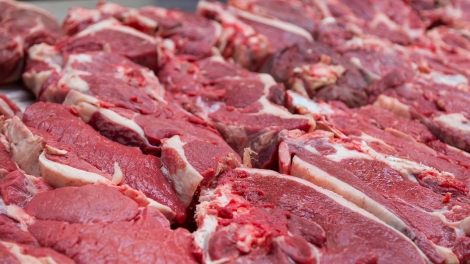 Pieces of fresh beef lying on the counter on the market. Red meat