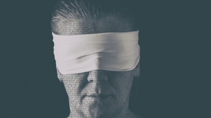 Blindfolded woman close up patterned with no-sense words. Concept of censorship freedom of speech freedom of press.