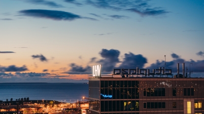 Tallinn Estonia - December 13 2017: Headquarter of LHV bank against modern architecture of city centre district.