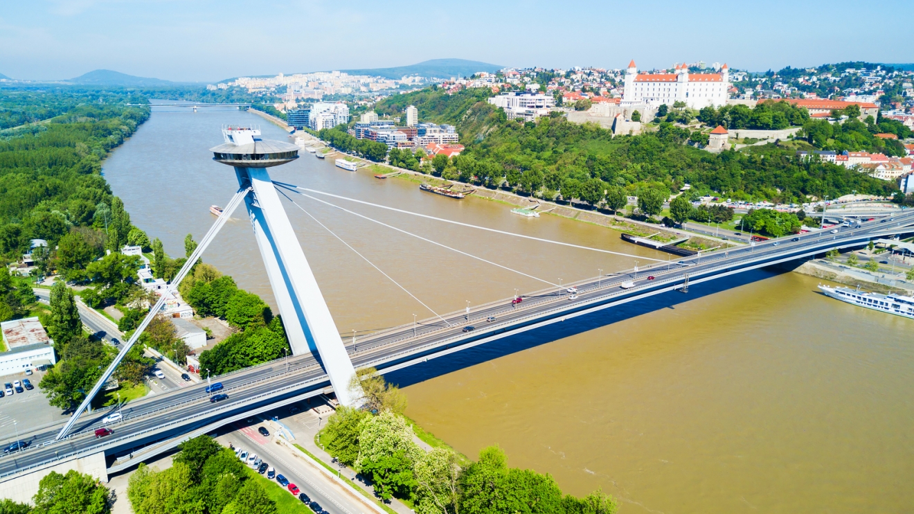 SNP New Bridge through Danude river aerial panoramic view in Bratislava. Bratislava is a capital of Slovakia.