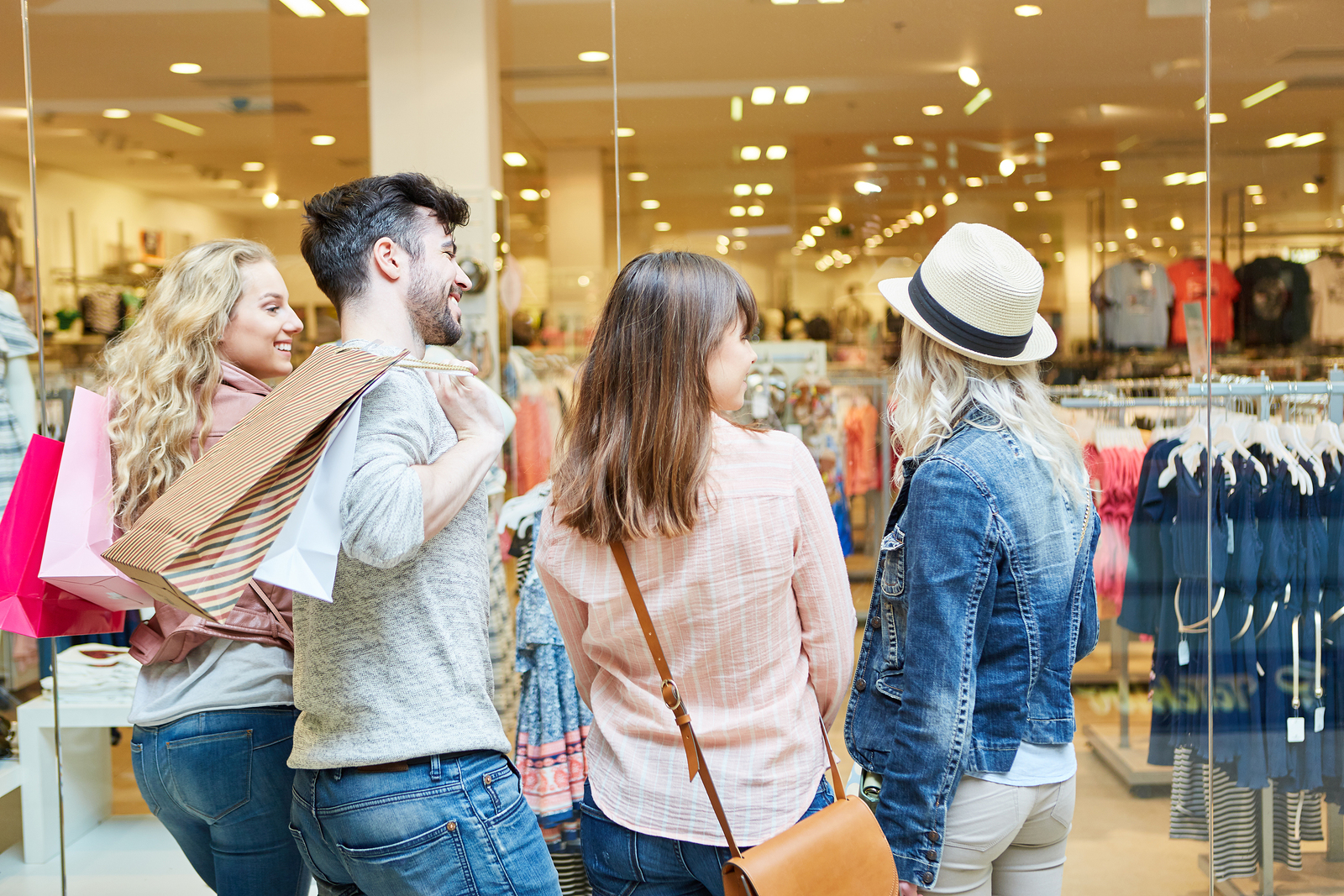 bigstock-Young-people-shopping-in-the-m-255894472
