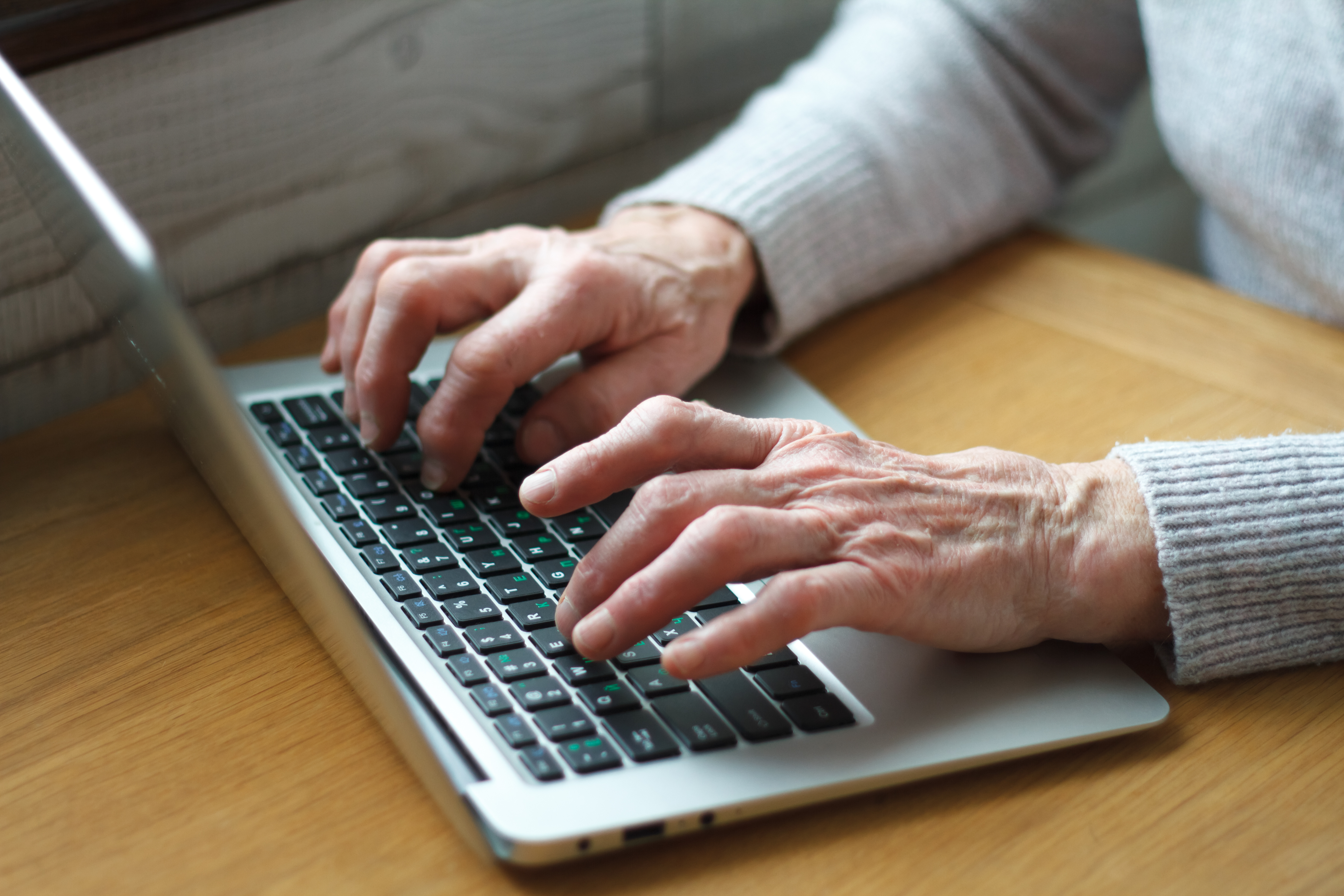 bigstock-Mature-Female-Hands-Typing-Tex-291211057