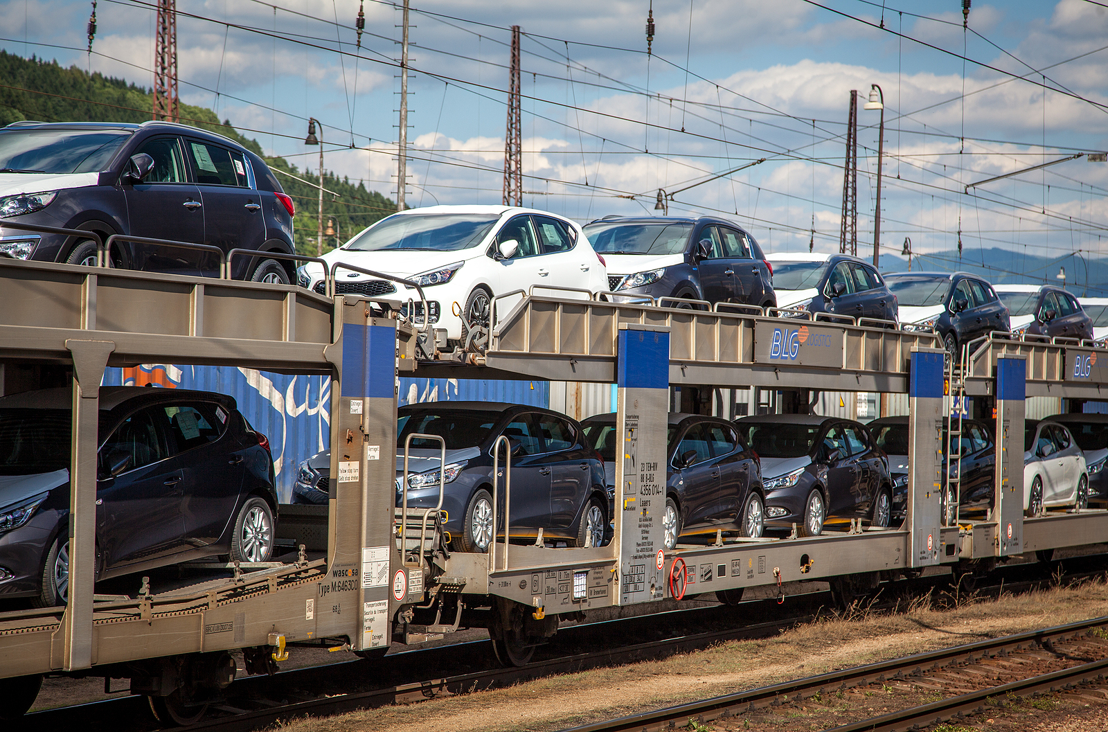 bigstock-Train-full-of-new-cars-69328186